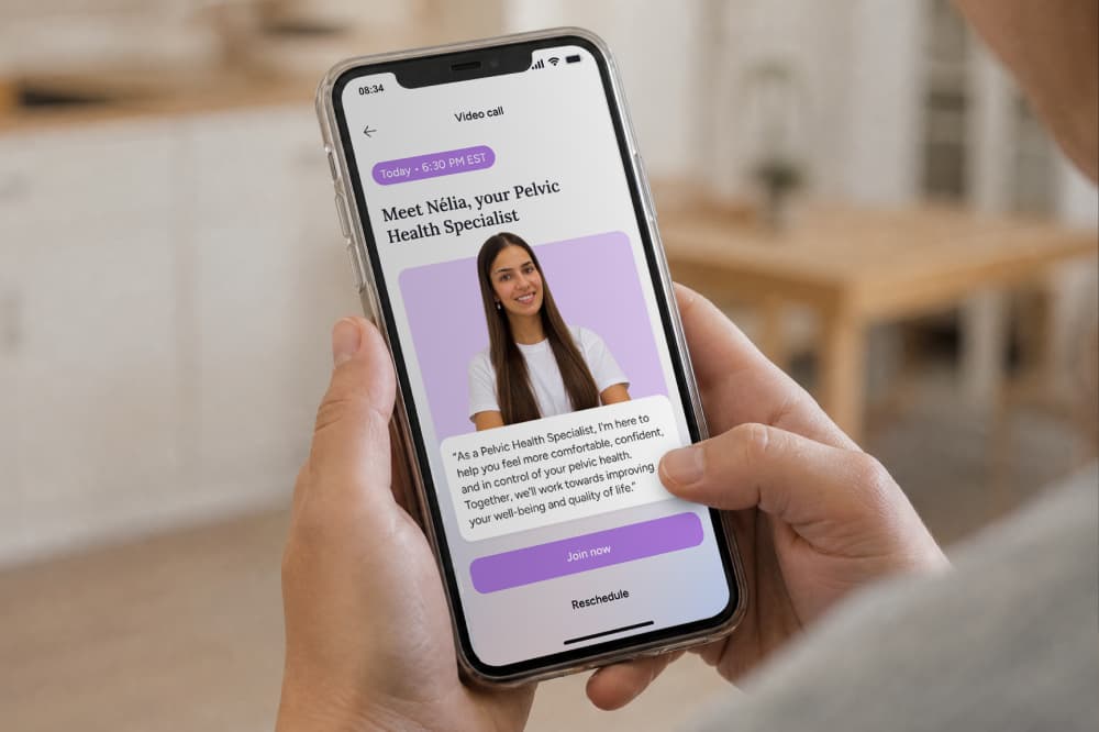 A person holding a smartphone displaying a video call invitation to meet with a pelvic health specialist named Nélia.