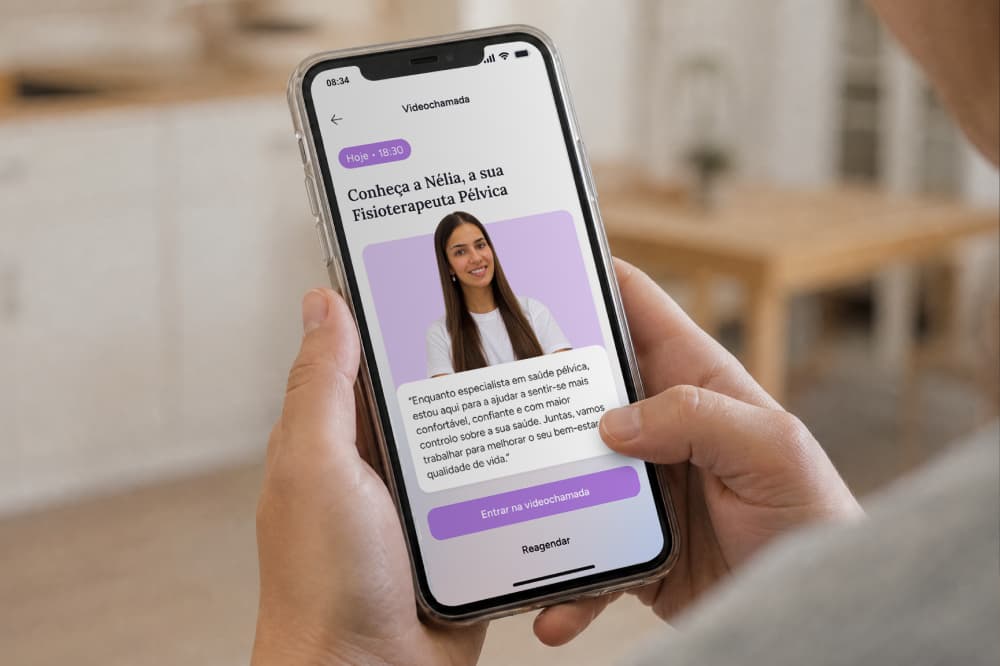 A person holding a smartphone displaying a video call interface for a pelvic health physical therapy appointment with a profile photo of a therapist and an option to join the call.